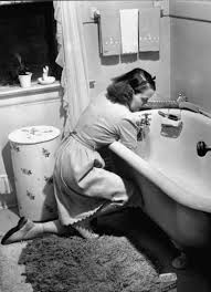 Vintage Woman cleaning bathtub